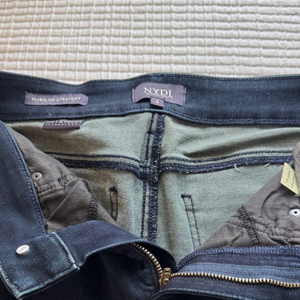 Dark wash denim jeans.  Super flattering fit.